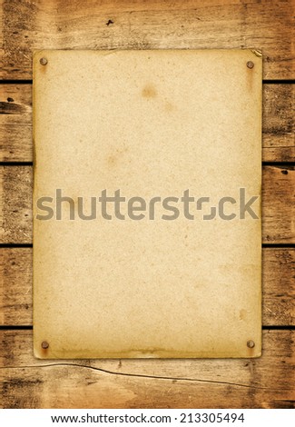 Blank vintage poster nailed on a wood board panel
