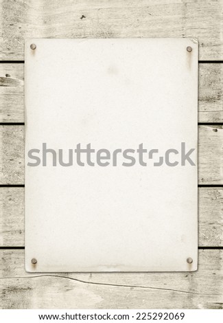 Blank vintage poster nailed on a white wood board panel