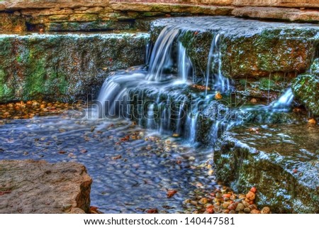 Long exposure of a beautiful cascading waterfall in the spring time in High Dynamic Range.