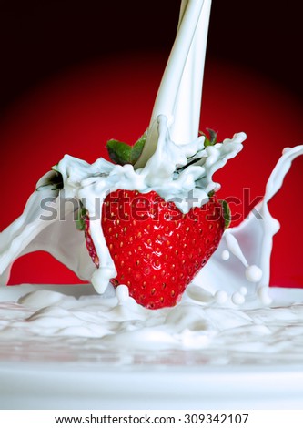 Strawberry with milk pour / splash