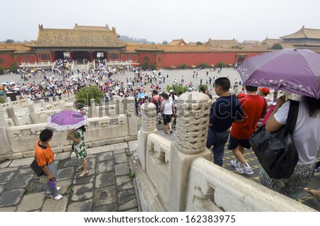 BEIJING, CHINA - AUGUST 18: Crowd on August 18, 2009 in Beijing: A multitude of tourists visit the Forbidden City.