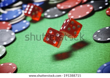 roll of the dice on a game table in a casino
