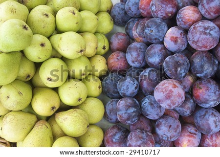 group of pears and plums in equal