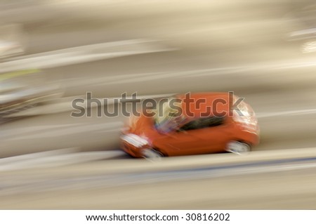 red car in motion