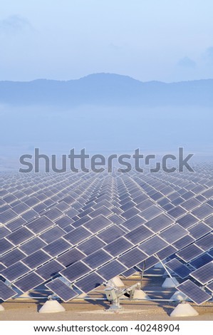group of photovoltaic panels at sunrise
