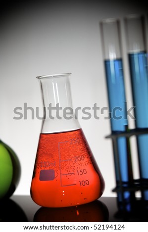 flask with bright red liquid in chemistry lab