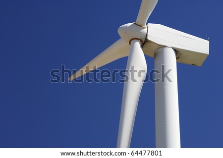 foreground of the top of a windmill for renewable electric energy production