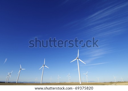 group of aligned windmills for electric power generation alternative