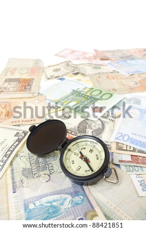 compass and  banknotes of different countries