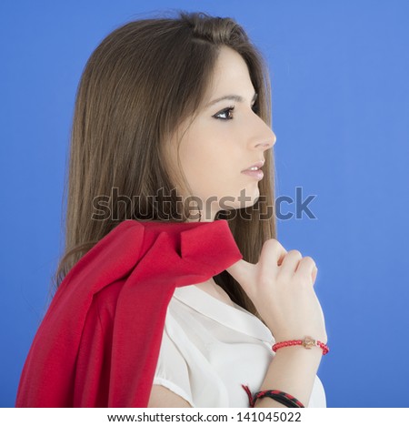 Portrait of urban business woman wearing tie, isolated on blue