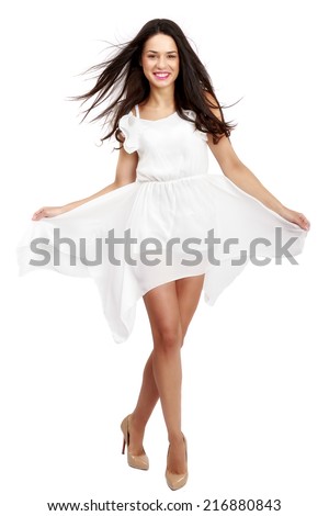 Beautiful woman in white dress on white background