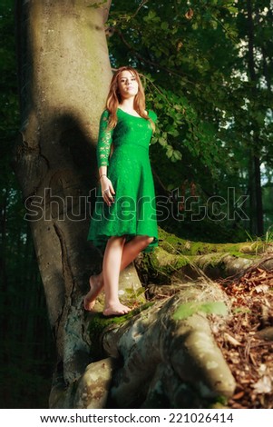 Portrait of romantic woman at fairy forest