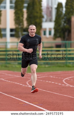 healthy man run on athletics race sport track and representing concept of sport and speed