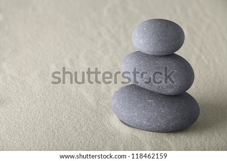 balance spirituality spa background with round stones and sand in a Japanese zen garden concept for simplicity harmony meditation and relaxation