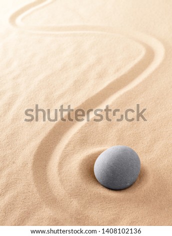 Zen meditation stone to focus and concentrate for a quiet peace of mind. Spiritual raked sand background texture. Concept for harmony purity and spirituality.  Foto d'archivio © 