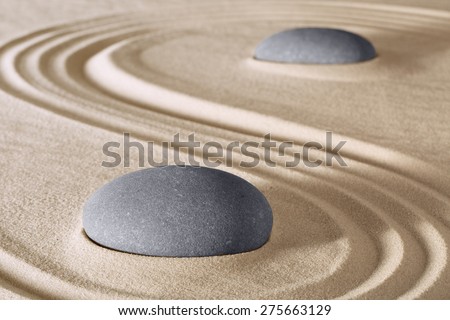 zen stones meditation and relaxation in Japanese zen garden. Stone and sand lines pattern background