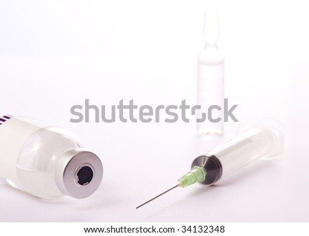 vaccination or medicine syringe and glass bottles flu vaccine immunization influenza vaccine