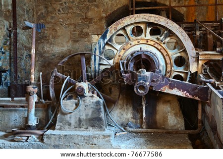 old rusty vintage industrial machinery weathered wheel of mine industry antique engine