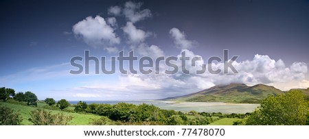 Ireland landscape with clouds mountains sea the ocean and the beach