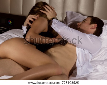guy laying in bed naked carbon dating errors