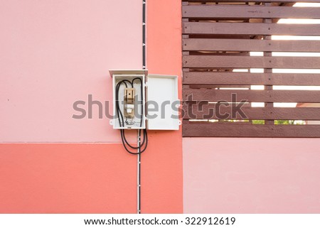 electric switch breaker inside a cover with pink background