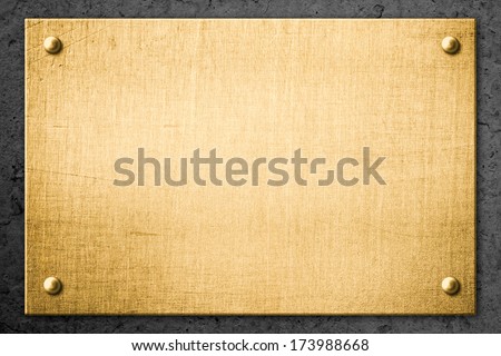 golden metal plate or signboard on wall background