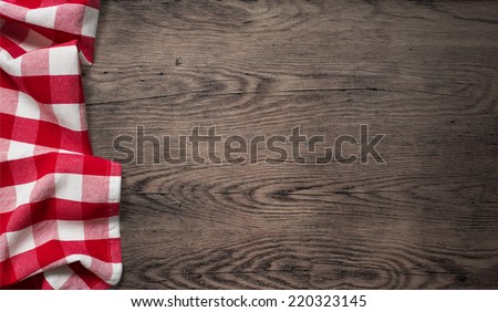 picnic tablecloth on old wooden table top view