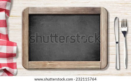 Menu chalkboard top view on table with knife and fork