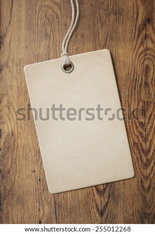 price tag or label on old wooden table background