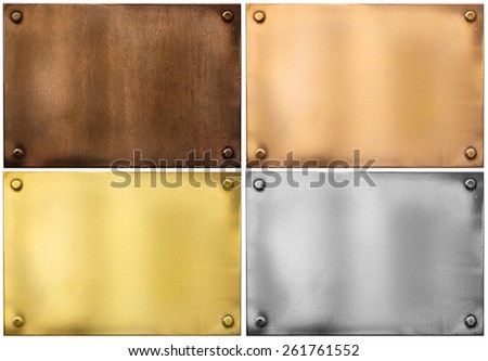 four various metal plates or plaques with rivets isolated on white including silver, brass or gold, bronze and rusty one