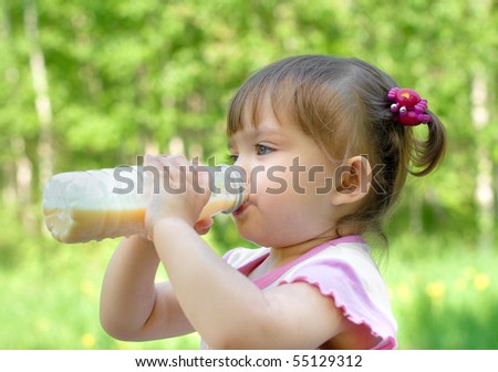 Little girl portrait drinking milk beverage