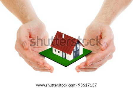 Hands holding small house isolated on white