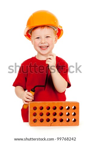 Builder boy or kid in red tshirt and hard hat. Construction concept.