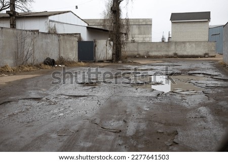 Similar – Foto Bild alte verlassene Asphaltstraße mit verunstalteten Fahrbahnmarkierungen