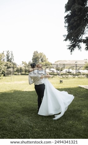 Similar – Image, Stock Photo Happy newlywed couple hugging on beach