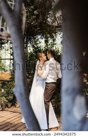 Similar – Image, Stock Photo Happy newlywed couple hugging on beach