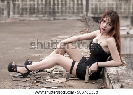 Portrait Of Sexy Asian Woman And Handgun In Old Building 603781358 Portrait Of Sexy Asian Woman And Handgun In Old Building 603781358