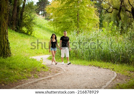 Teenage couple on a late summer afternoon in park