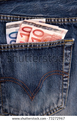 Pocket money - euro banknotes in a pocket of a blue jeans trousers
