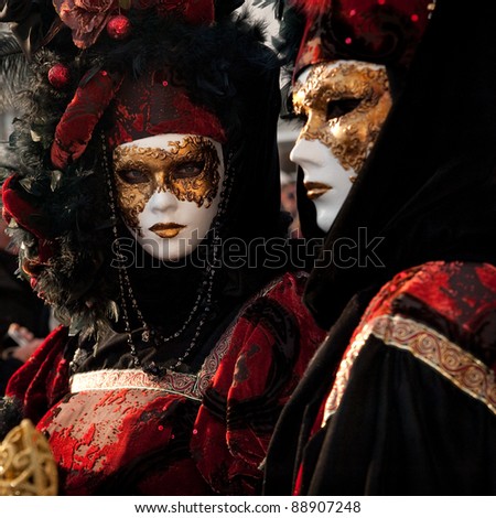 VENICE, ITALY - FEBRUARY 15: Unidentified people in Venetian masks at St. Mark\'s Square participate in the Carnival of Venice on February 15, 2010. The annual carnival is from February 6 to February 16, 2010.