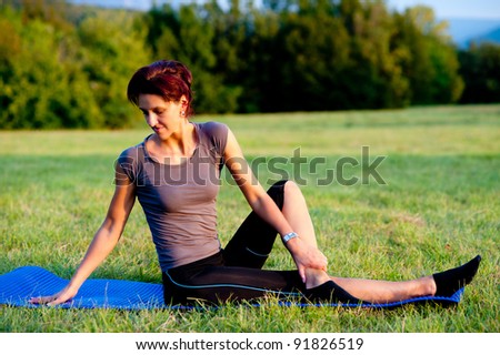 Woman practice yoga outdoor in park