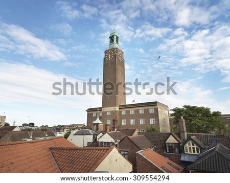 Shot of Norwich city hall clock tower that is a local landmark and well recognized in the eastern region of england. Copy space is provided in the sky for the designer to add type.