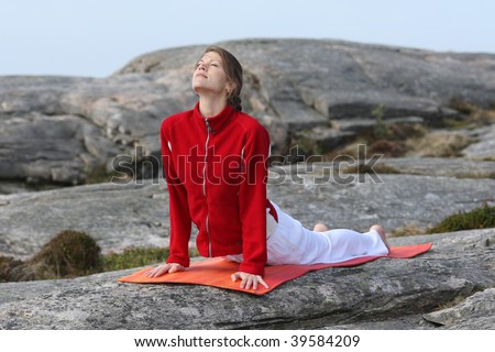 young woman exercising power yoga