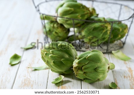 Similar – Image, Stock Photo Fresh green artichokes at the weekly market in Alacati in the province of Izmir at the Aegean Sea in Turkey