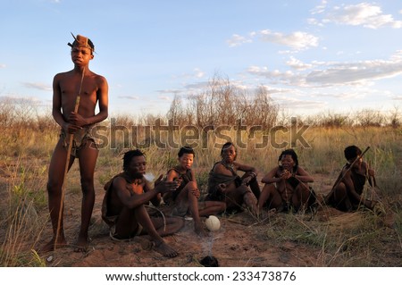 KALAHARI, BOTSWANA - DECEMBER 31, 2008: group of bushmen in the kalahari desert in Botswana