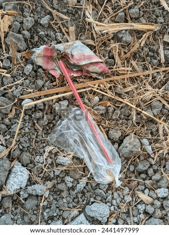 Similar – Image, Stock Photo Plastic straws thrown in ocean. Pollution concept. Flat lay on pink background