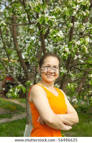 Happy  elderly  Woman Gardening In The Springtime Sunshine