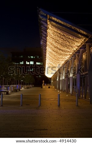 Outdoor restaurant area under a sea of twinkling lights