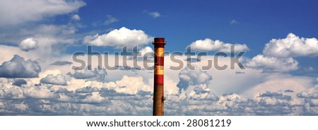 factory chimney with blue dramatic sky