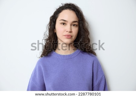 Similar – Image, Stock Photo Young Woman with Brown Hair and Black Coat Smiling in Park
